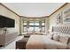 Main bedroom with lake views, plush bed, and stylish decor at 9088 Nautical Watch Dr, Indianapolis, IN 46236