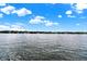 Calm lake with houses and lush greenery at 9088 Nautical Watch Dr, Indianapolis, IN 46236