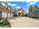 Two-story brick home with a large driveway and lush landscaping at 9088 Nautical Watch Dr, Indianapolis, IN 46236