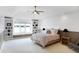 Lake view bedroom with built-in shelves and window seat at 9088 Nautical Watch Dr, Indianapolis, IN 46236