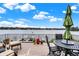 Deck overlooking the lake with seating and a table at 9088 Nautical Watch Dr, Indianapolis, IN 46236