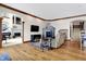 Cozy Gathering room with a fireplace, hardwood floors, and built-in shelving at 9088 Nautical Watch Dr, Indianapolis, IN 46236