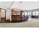 Basement rec room with kitchenette, game tables, and lake views at 9088 Nautical Watch Dr, Indianapolis, IN 46236