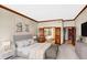 Main bedroom with a plush bed, sitting area, and ensuite bathroom access at 9088 Nautical Watch Dr, Indianapolis, IN 46236