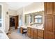 Bathroom with double vanity, stained glass window and access to walk-in closet at 9088 Nautical Watch Dr, Indianapolis, IN 46236