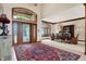 Two-story entry with chandelier, hardwood floors, and formal dining area at 9088 Nautical Watch Dr, Indianapolis, IN 46236