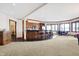 Basement rec room with kitchenette, game tables, and lake views at 9088 Nautical Watch Dr, Indianapolis, IN 46236