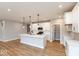 Modern kitchen with white cabinets, quartz countertops, and stainless steel appliances at 7123 Bailow Ct, McCordsville, IN 46055