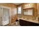 Powder room with decorative walls and a large mirror at 7260 Josiah Ct, Indianapolis, IN 46259