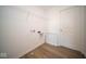 Laundry room with shelving and space for washer and dryer at 1678 Orchard Dr, Fortville, IN 46040