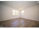 Well-lit bedroom featuring wood-look floors and recessed lighting at 1678 Orchard Dr, Fortville, IN 46040