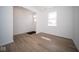Spacious entryway showcasing wood-look floors and natural light at 1678 Orchard Dr, Fortville, IN 46040