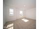 Bright bedroom with neutral carpeting and two large windows at 1678 Orchard Dr, Fortville, IN 46040