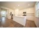 Modern kitchen with white cabinets and island at 1678 Orchard Dr, Fortville, IN 46040