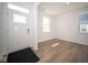 Bright entryway with wood-look floors and access to other rooms at 1678 Orchard Dr, Fortville, IN 46040