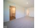 Spacious bedroom with neutral carpeting and en-suite bathroom at 1678 Orchard Dr, Fortville, IN 46040