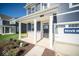 Two-story home with a covered porch and brick entryway at 1678 Orchard Dr, Fortville, IN 46040