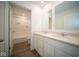 Modern bathroom with double vanity and a shower/tub combo at 1678 Orchard Dr, Fortville, IN 46040