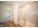 Modern bathroom with walk-in shower and neutral flooring at 1678 Orchard Dr, Fortville, IN 46040