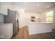 Modern kitchen with stainless steel appliances and island at 1678 Orchard Dr, Fortville, IN 46040