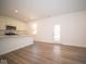 Open concept living room with kitchen and patio door at 1678 Orchard Dr, Fortville, IN 46040