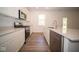 Bright kitchen featuring stainless steel appliances and hardwood floors at 1678 Orchard Dr, Fortville, IN 46040