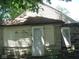 Older home with white siding and stone foundation at 3242 S Rybolt Ave, Indianapolis, IN 46221