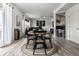 Bright dining area with round wooden table and four black chairs at 8816 Blue Marlin Dr, Indianapolis, IN 46239