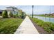 Concrete pathway alongside a tranquil canal at 1453 Andante Way, Westfield, IN 46074