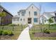 Brick house with a walkway and black fence at 1453 Andante Way, Westfield, IN 46074