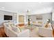 Elegant living room with hardwood floors, white sofas, and gold accents at 2150 Washington St, Columbus, IN 47201
