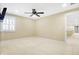 Bright bedroom featuring carpet, ceiling fan, and window with shutters at 2150 Washington St, Columbus, IN 47201