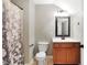 Simple bathroom with a single vanity, toilet and shower/tub combo at 2150 Washington St, Columbus, IN 47201