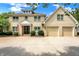 Brick house with three-car garage and landscaped yard at 2150 Washington St, Columbus, IN 47201