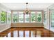 Bright dining room with hardwood floors and large windows at 2150 Washington St, Columbus, IN 47201