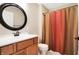 Bathroom with single vanity, toilet, and shower/tub combo at 2150 Washington St, Columbus, IN 47201