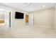 Large bedroom with neutral decor, carpet flooring, and a TV at 2150 Washington St, Columbus, IN 47201