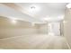 Finished basement with neutral walls and carpet at 2150 Washington St, Columbus, IN 47201