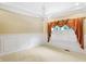 Elegant dining room with chandelier and window seat at 2150 Washington St, Columbus, IN 47201