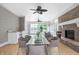 Spacious sunroom with wicker furniture and fireplace at 2150 Washington St, Columbus, IN 47201