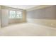 Bright bedroom featuring neutral walls and carpet at 2150 Washington St, Columbus, IN 47201