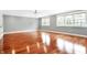 Large bedroom with hardwood floors and bright natural light at 2150 Washington St, Columbus, IN 47201