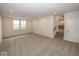 Finished basement with neutral carpeting and ample space at 9317 Coopers Ln, McCordsville, IN 46055