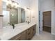 Elegant bathroom with double vanity, walk-in shower, and large closet at 9317 Coopers Ln, McCordsville, IN 46055