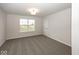 Well-lit bedroom with carpet flooring and a view from the window at 9317 Coopers Ln, McCordsville, IN 46055