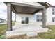 Covered patio with brick columns and sliding glass door access at 9317 Coopers Ln, McCordsville, IN 46055