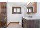 Bathroom with brown vanity, white countertop, and tiled floor at 1117 N Parker Ave, Indianapolis, IN 46201