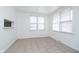 Simple dining area with tiled floor and two windows at 1117 N Parker Ave, Indianapolis, IN 46201