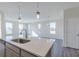 Kitchen island with white countertop and stainless steel sink at 5729 Cr W 750 N, McCordsville, IN 46055