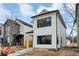 Modern two-story home with white siding and black window frames at 1647 Sheldon St, Indianapolis, IN 46218
